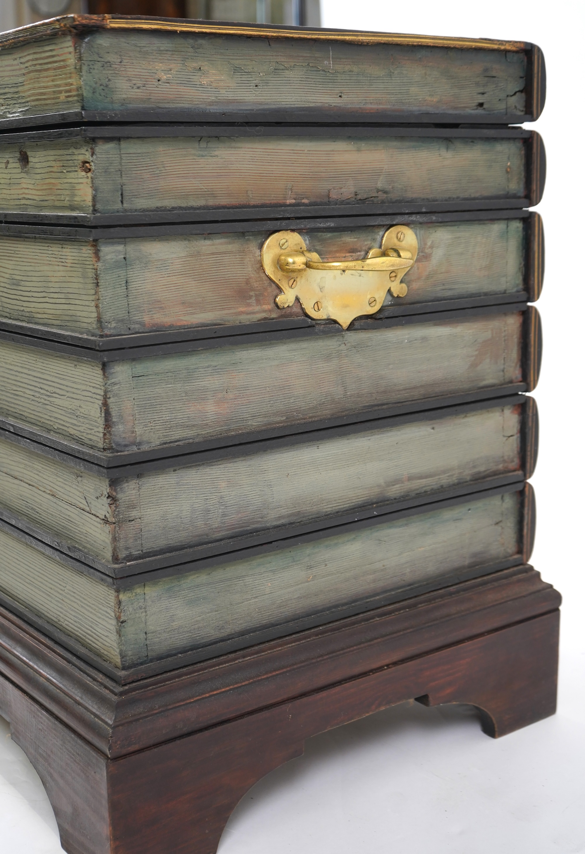 A Victorian style cellarette modelled as a stack of antiquarian books